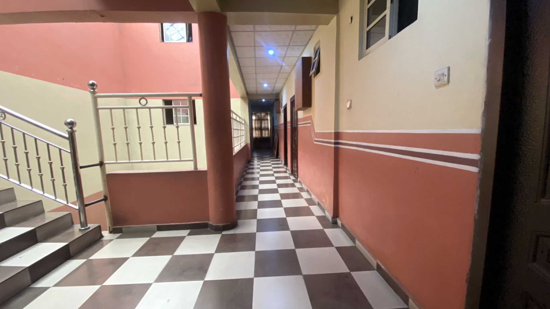 Hotel interior — guest corridor and stairway