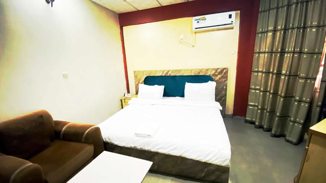 Delux Room — bright bedroom and lounge